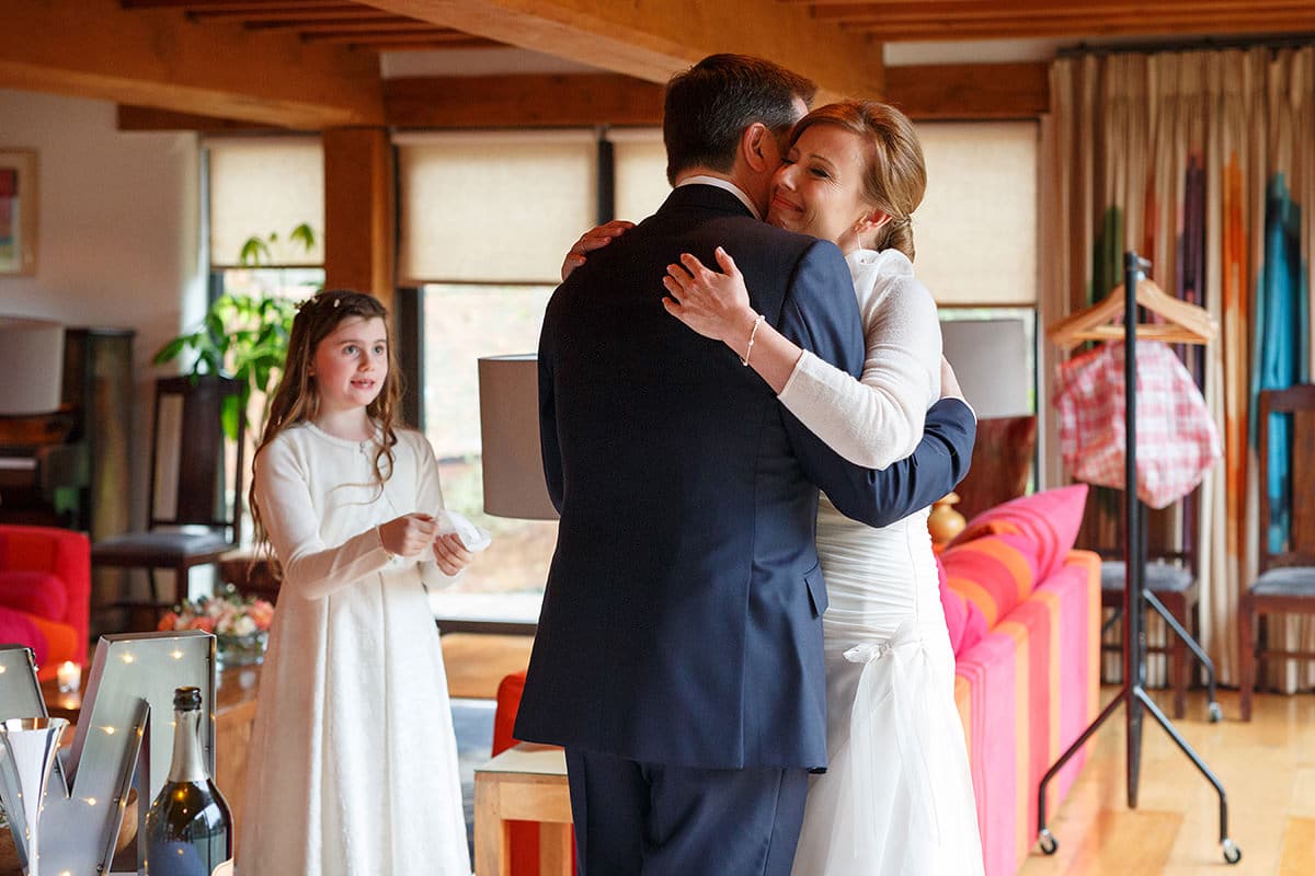 the bride and groom hug after their first look