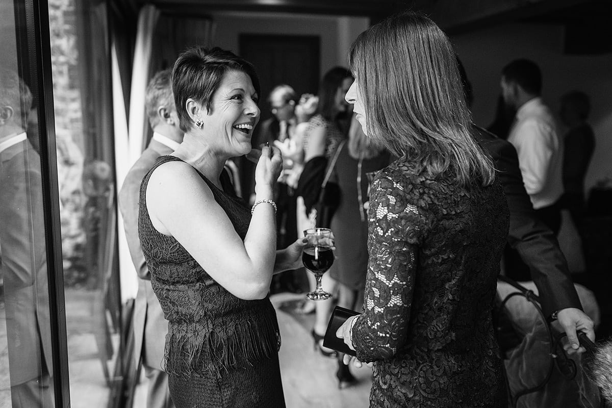 wedding guests chat before the ceremony