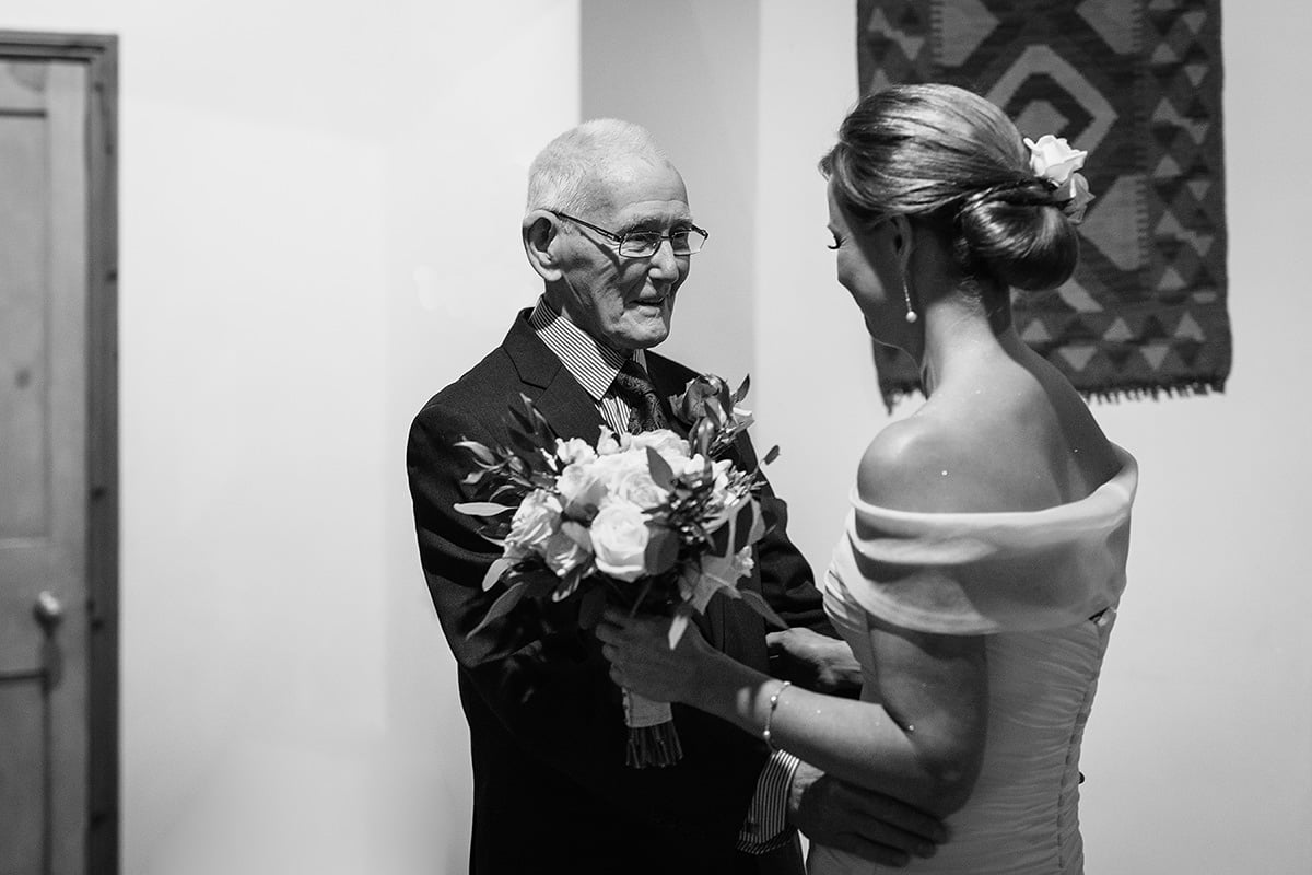 the bride and her father embrace