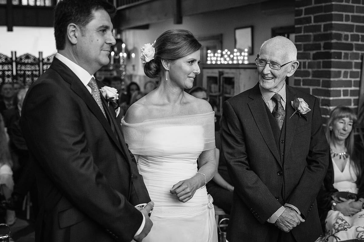 the father of the bride smiles