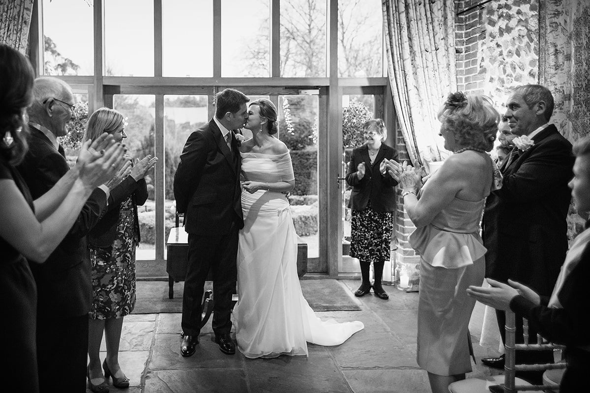 the bride and groom kiss after the ceremony