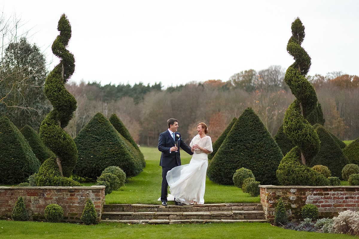 the bride and groom kiss outside chaucer barn