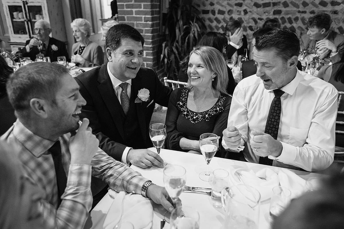 the groom talks with his family