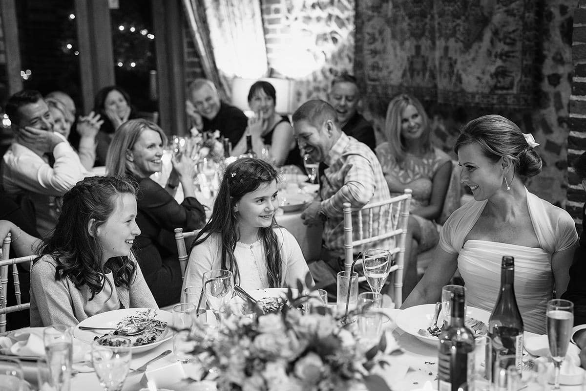 the couples daughter smiles during the speech