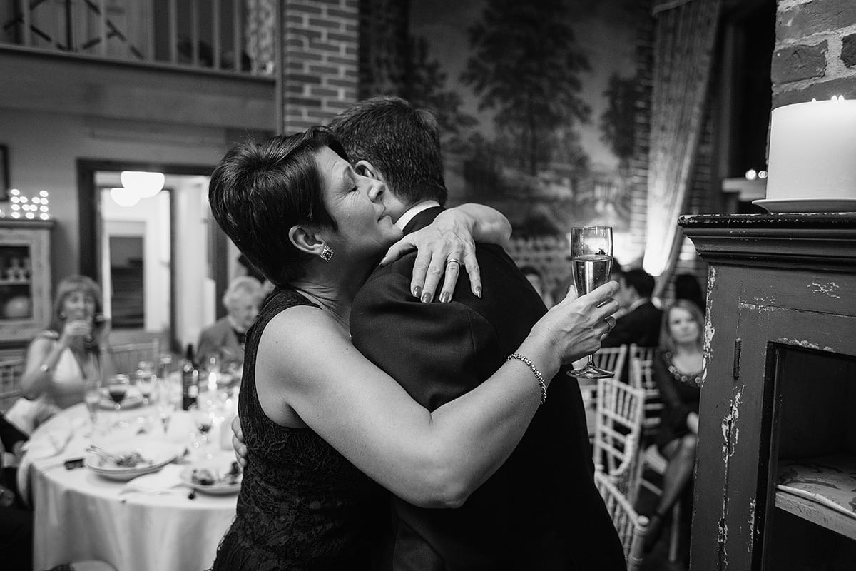 the groom hugs his sister