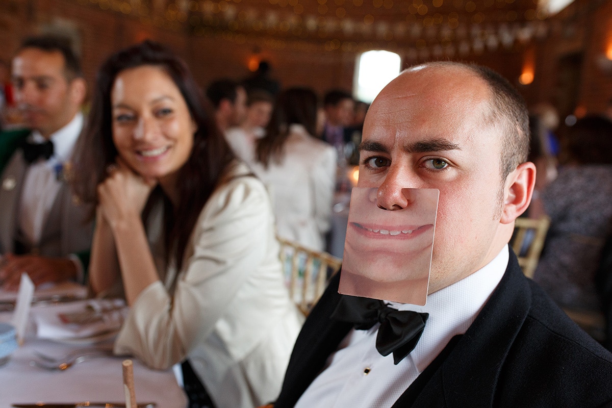 a wedding guest pulling a silly face