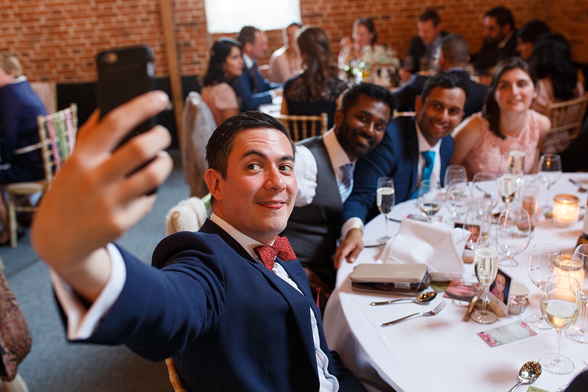 wedding guests taking a selfie at godwick barn