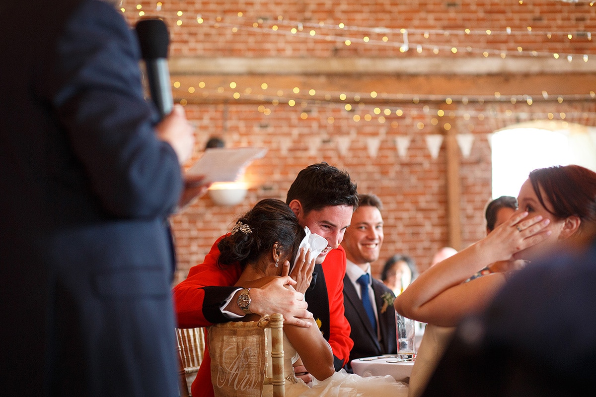 rob cuddles sam during the wedding speeches