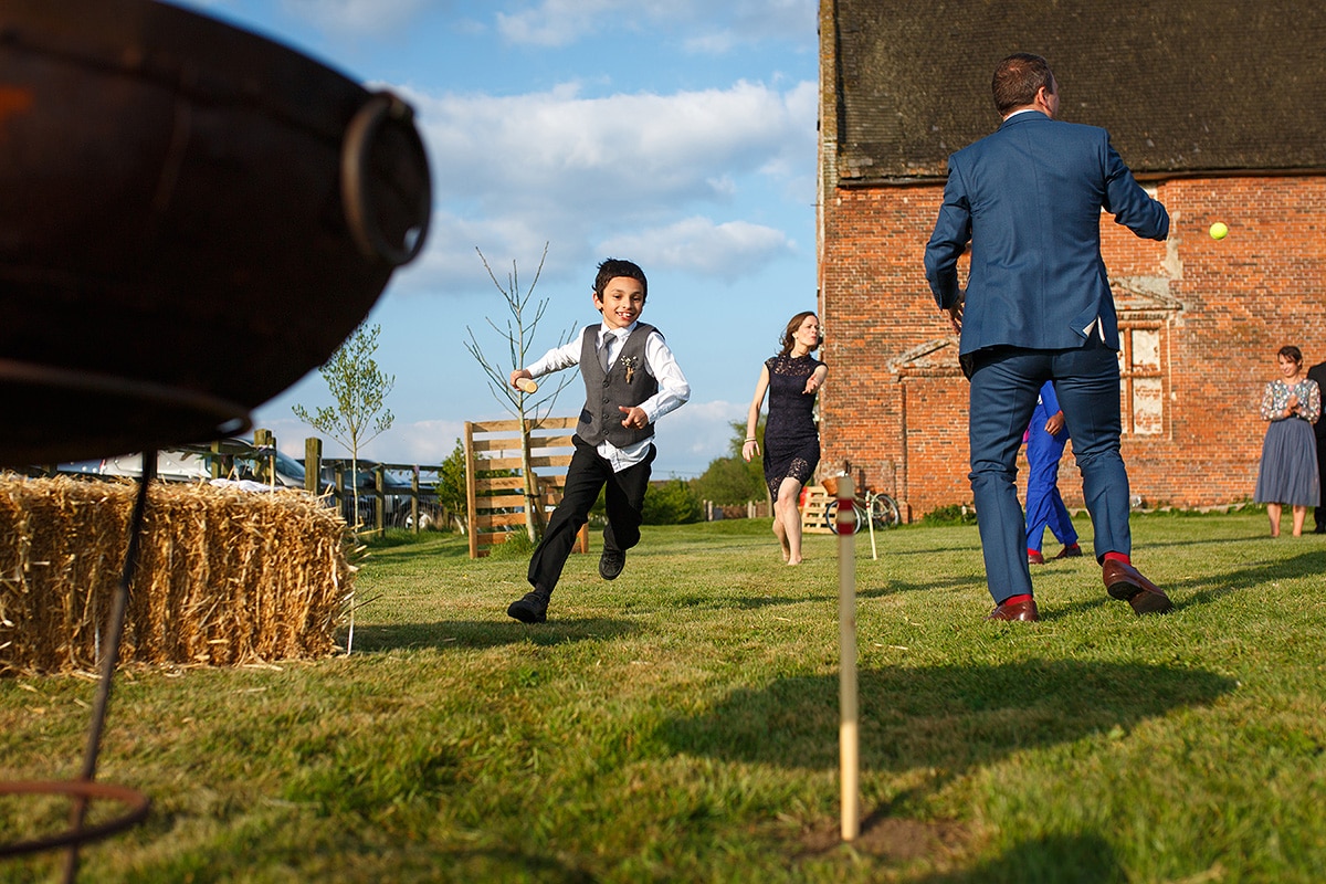 guests play rounders outside godwick barn