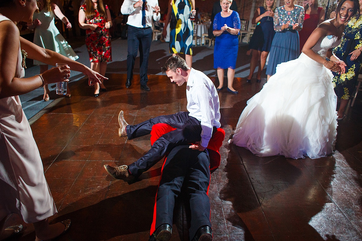 a guest sits on rob on the dance floor