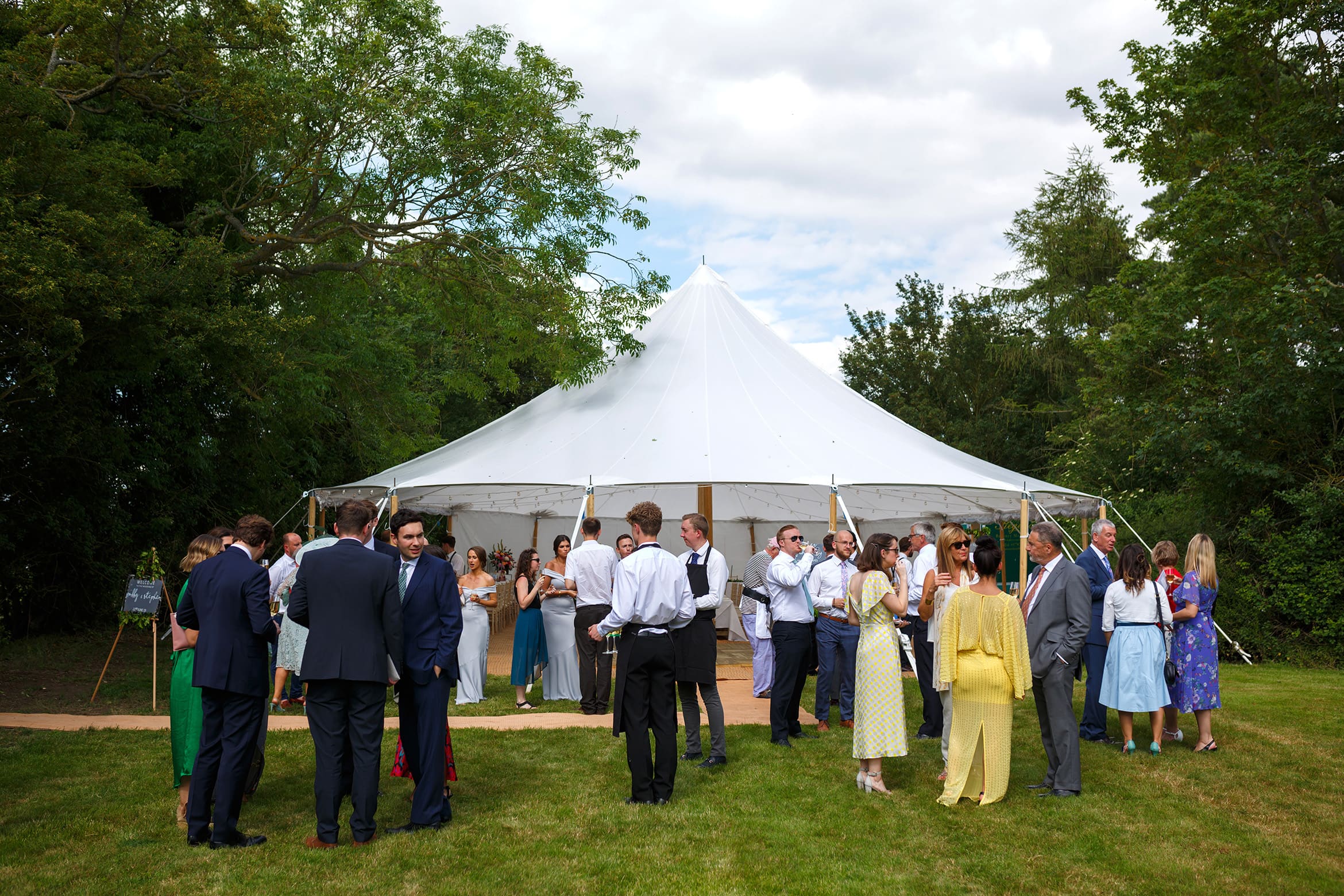 guests outside the wedding marquee