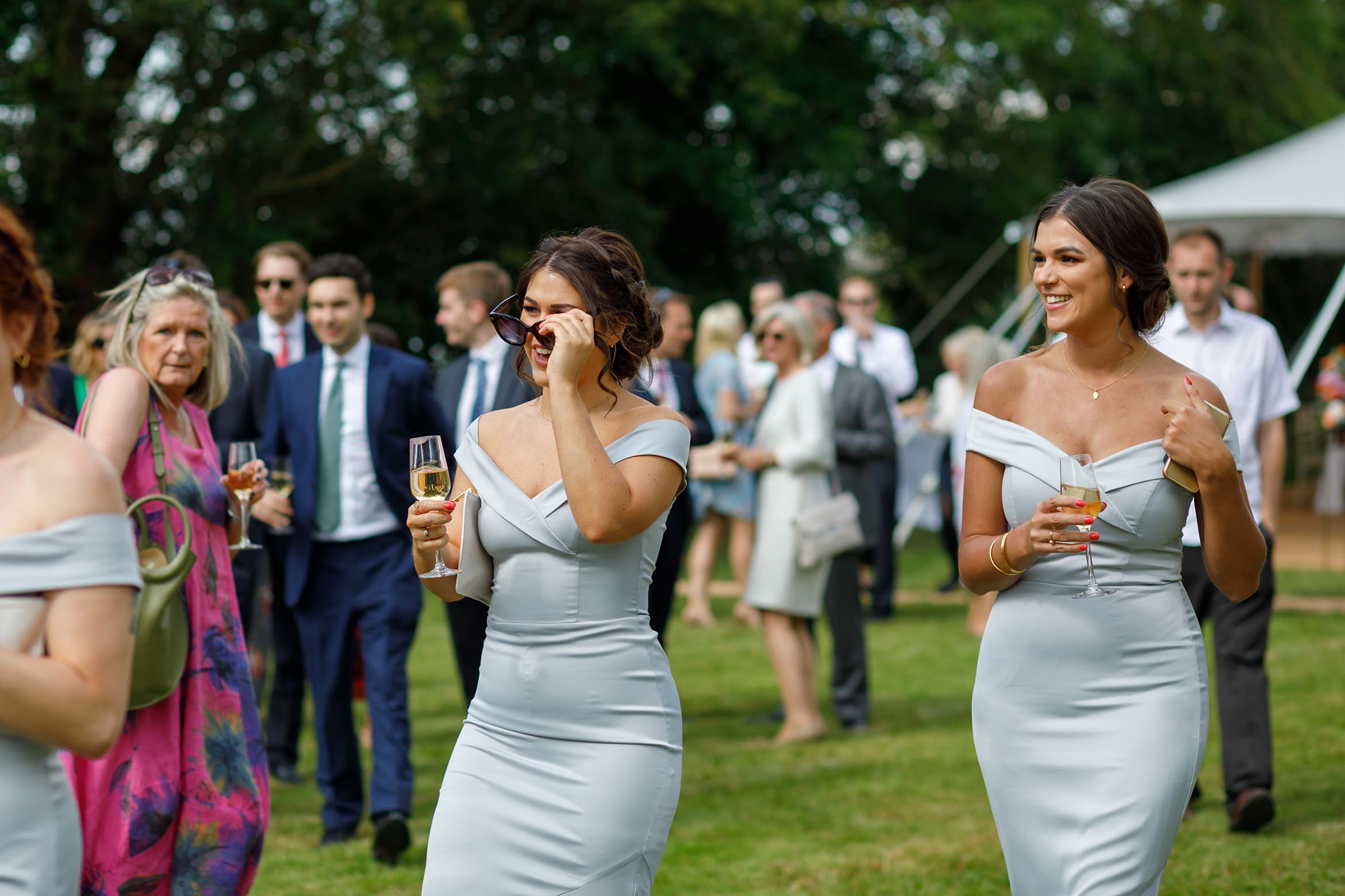 bridesmaids walk to welcome the bride and groom