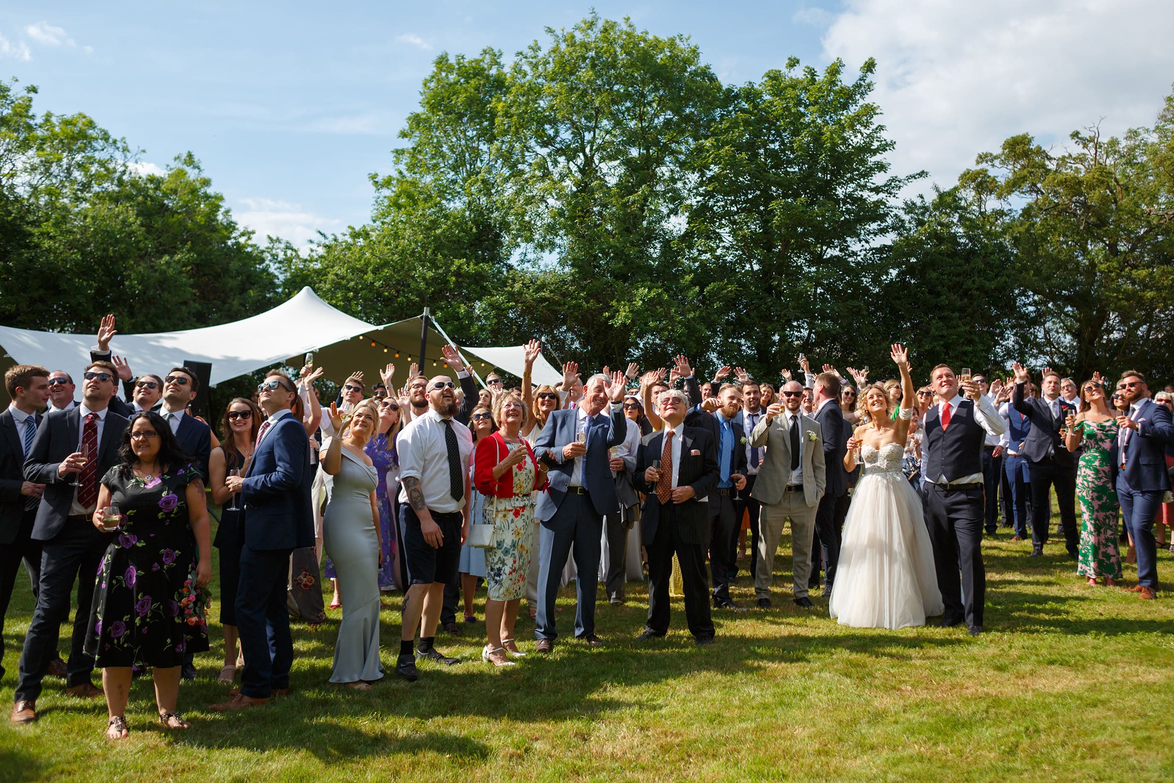 guests assemble to wave at a drone