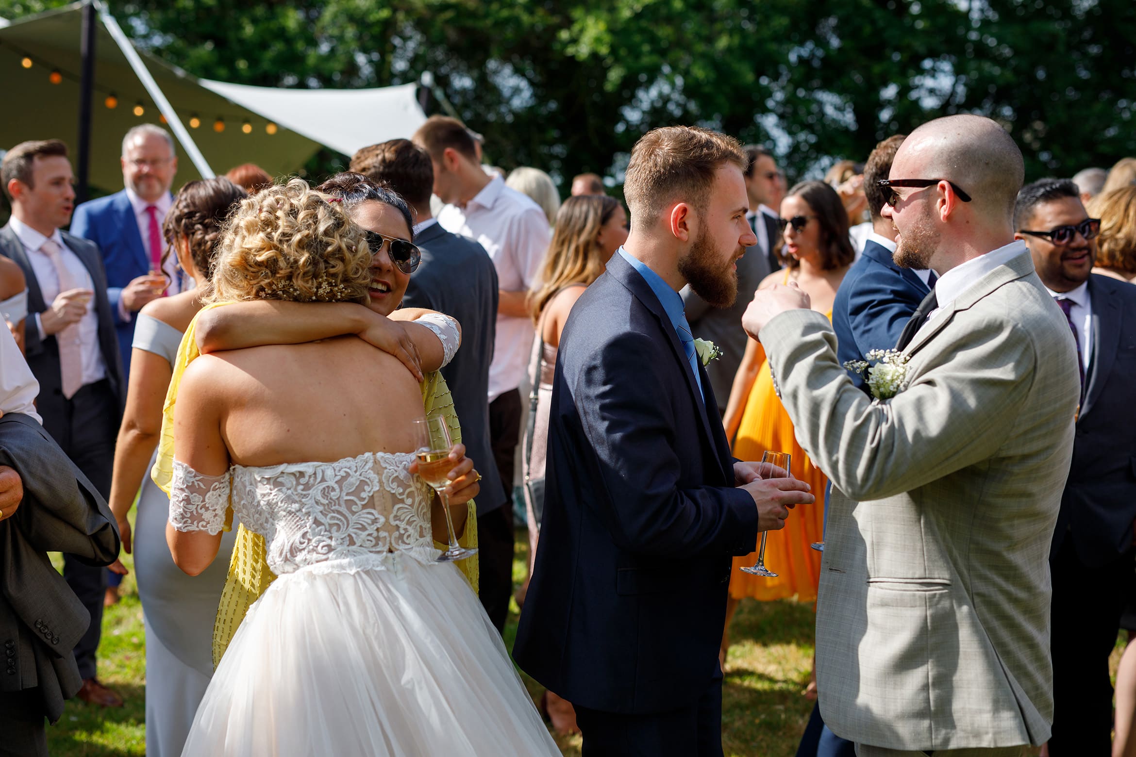 the bride hugs one of her guests
