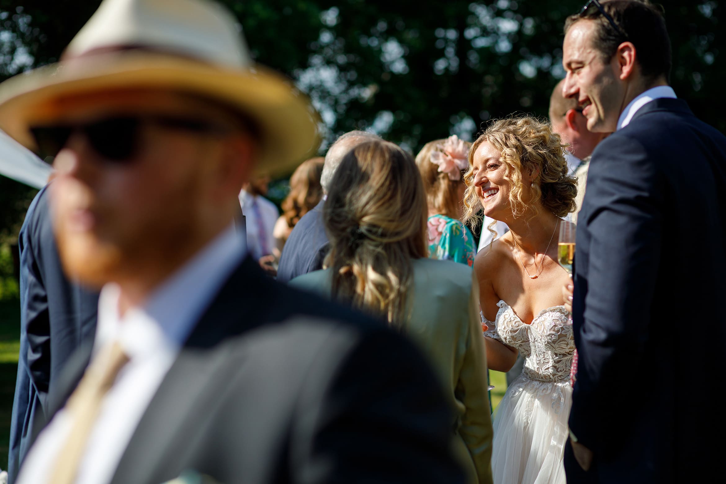 the bride smiling in the summer sunshine