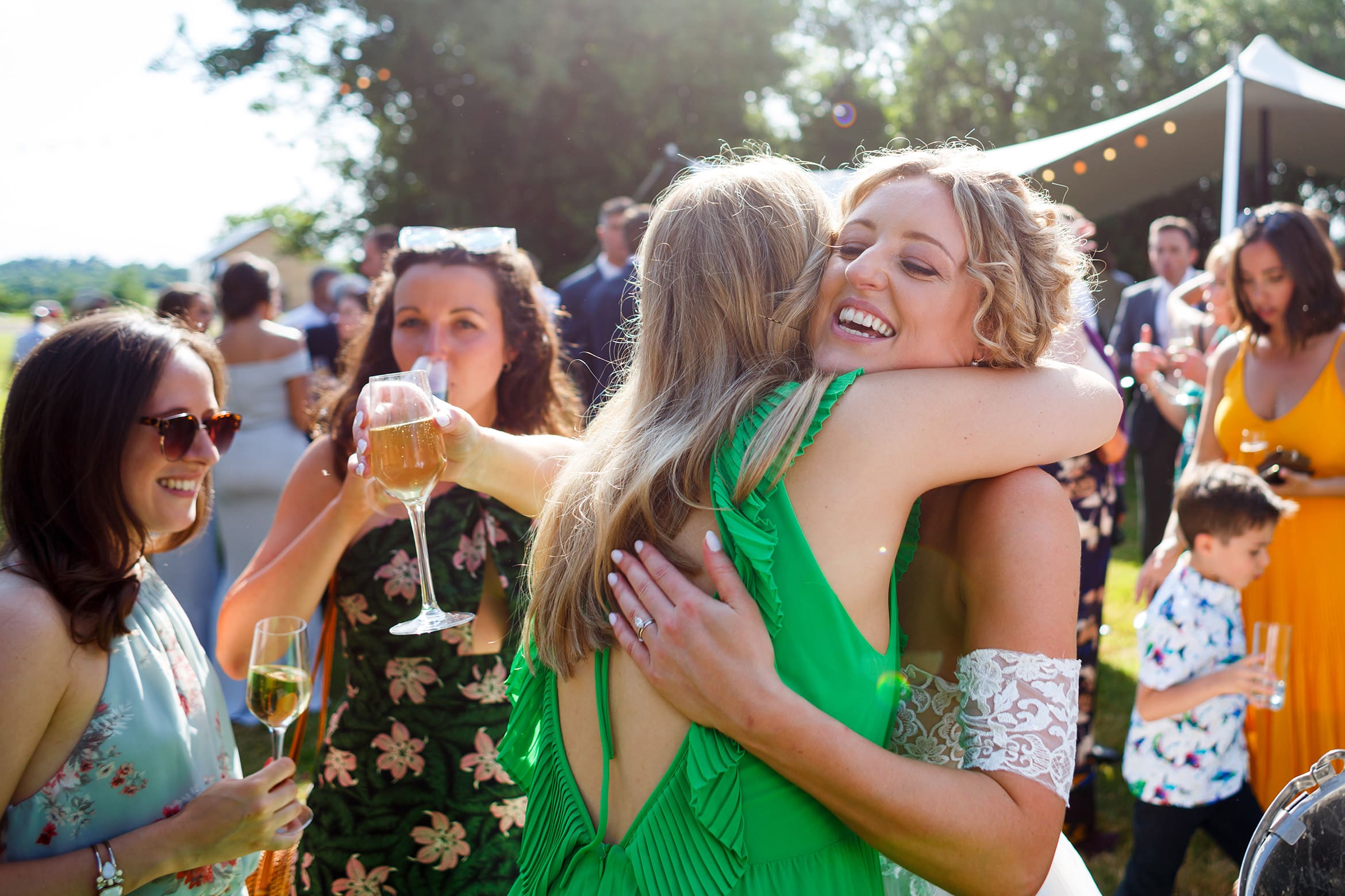 the bride hugs one of her friends