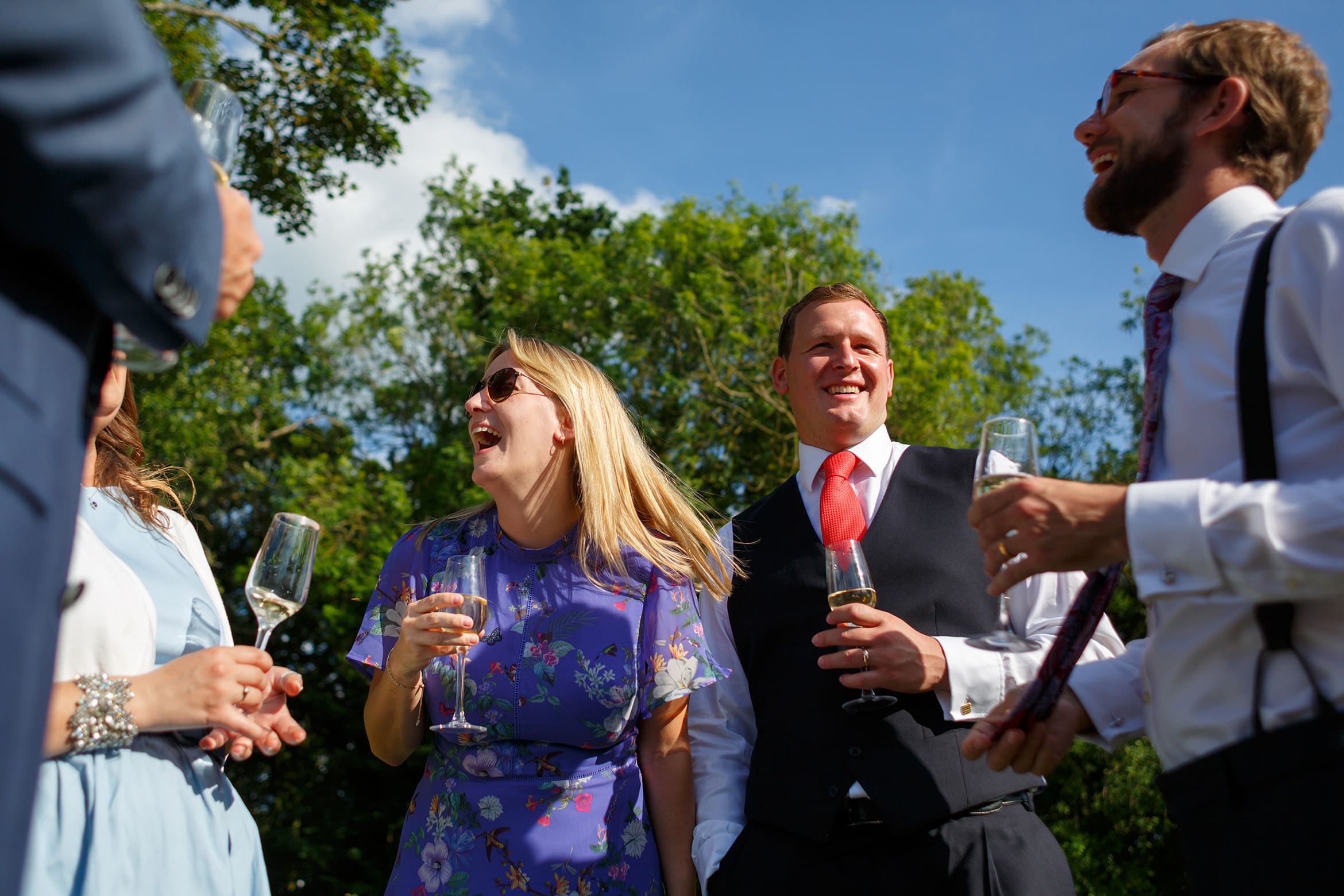 the groom laughs with his family
