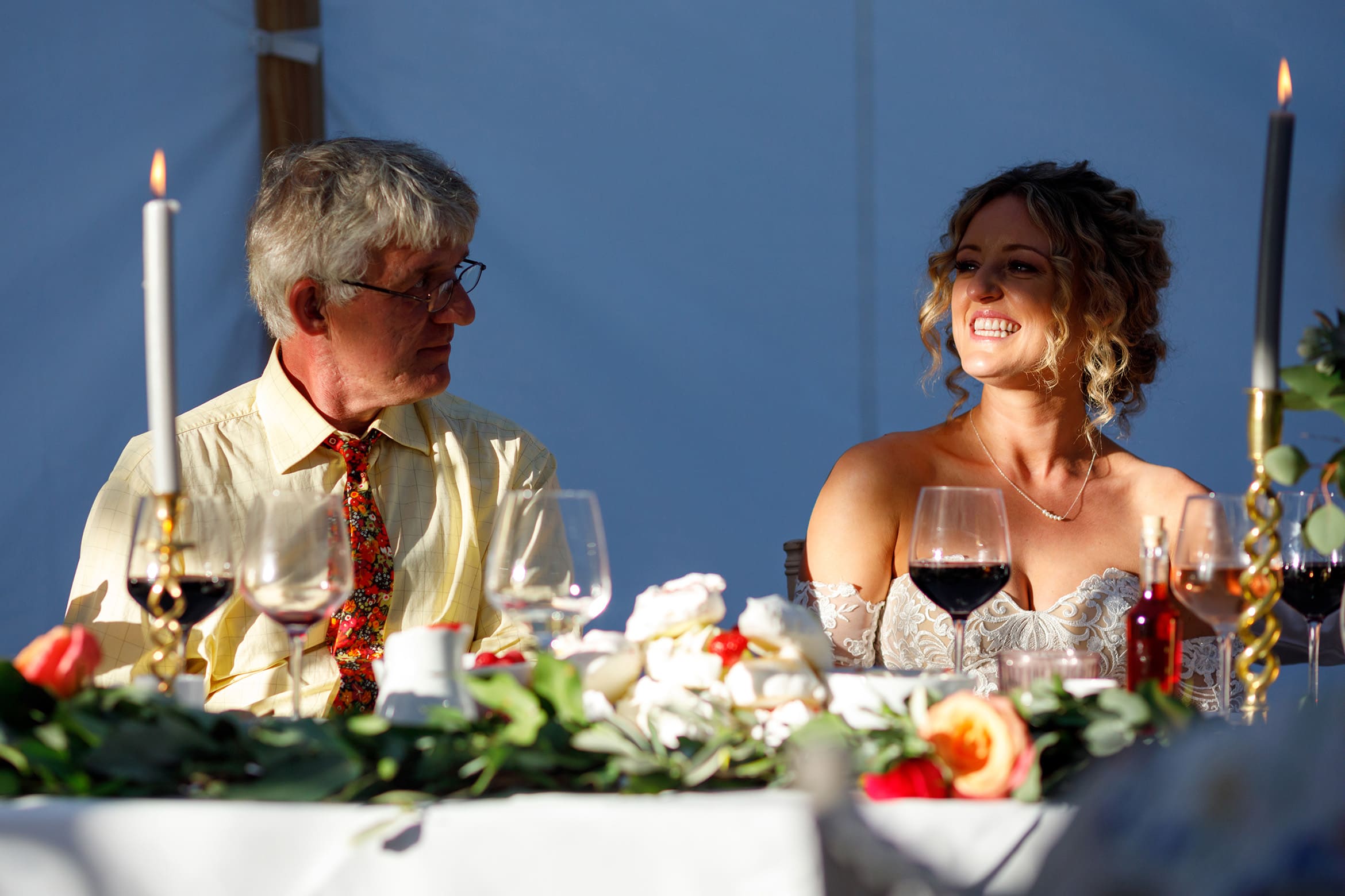 the bride smiles in a shaft of sunlight