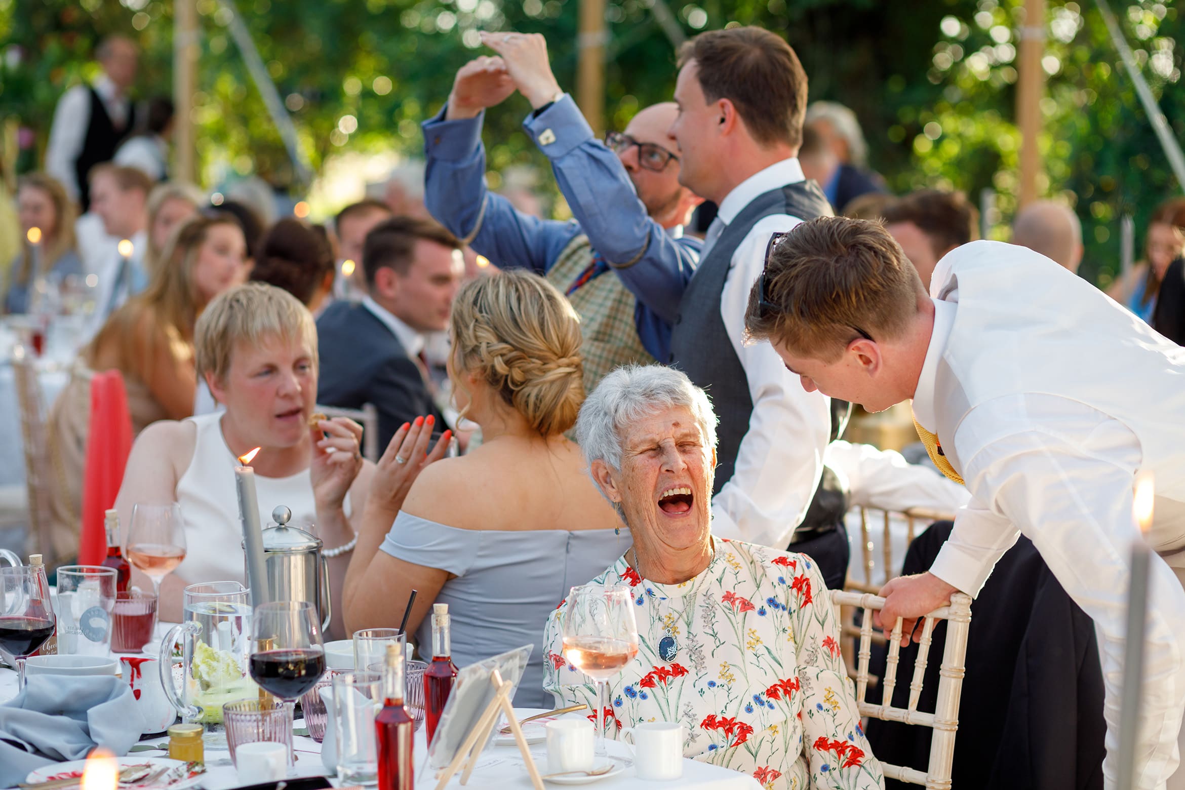 a laughing wedding guest