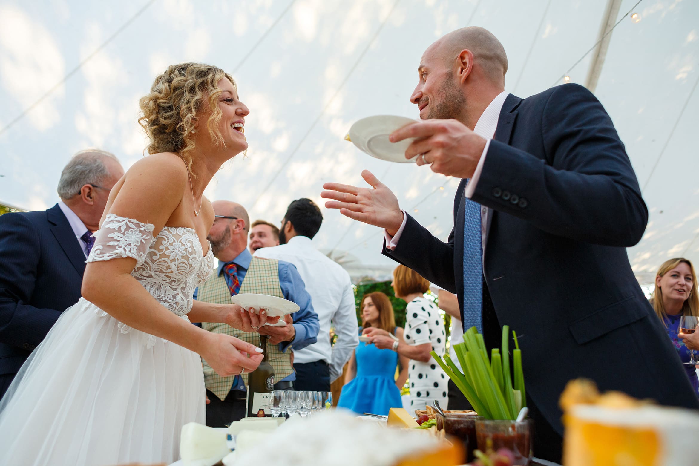 the bride chats to one of her wedding guests