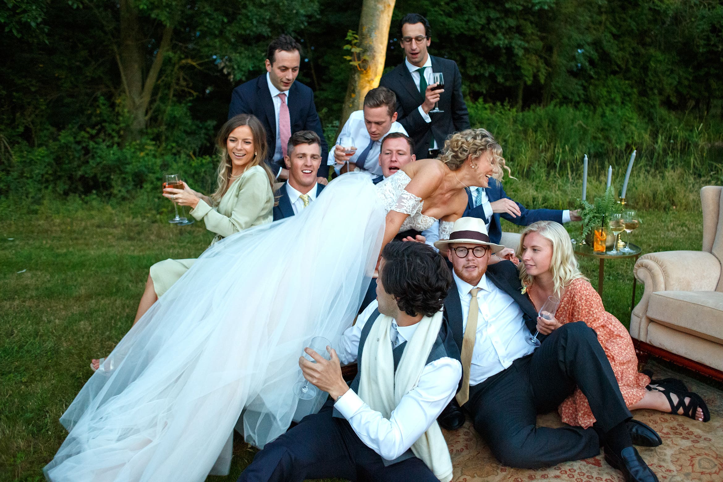 the bride dives onto a group of guests