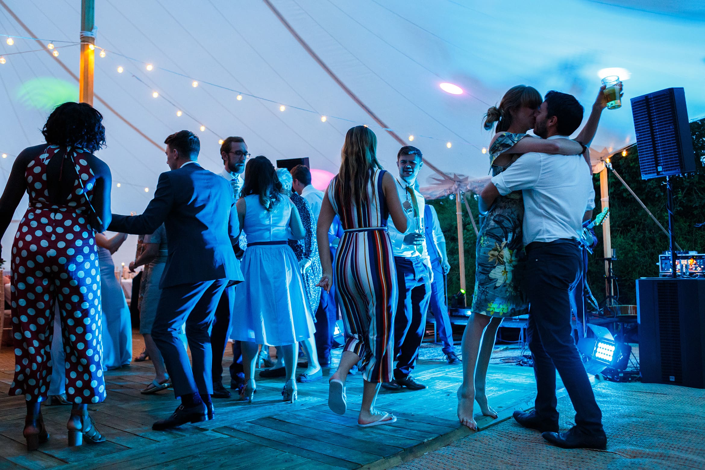 a couple kiss on the dancefloor