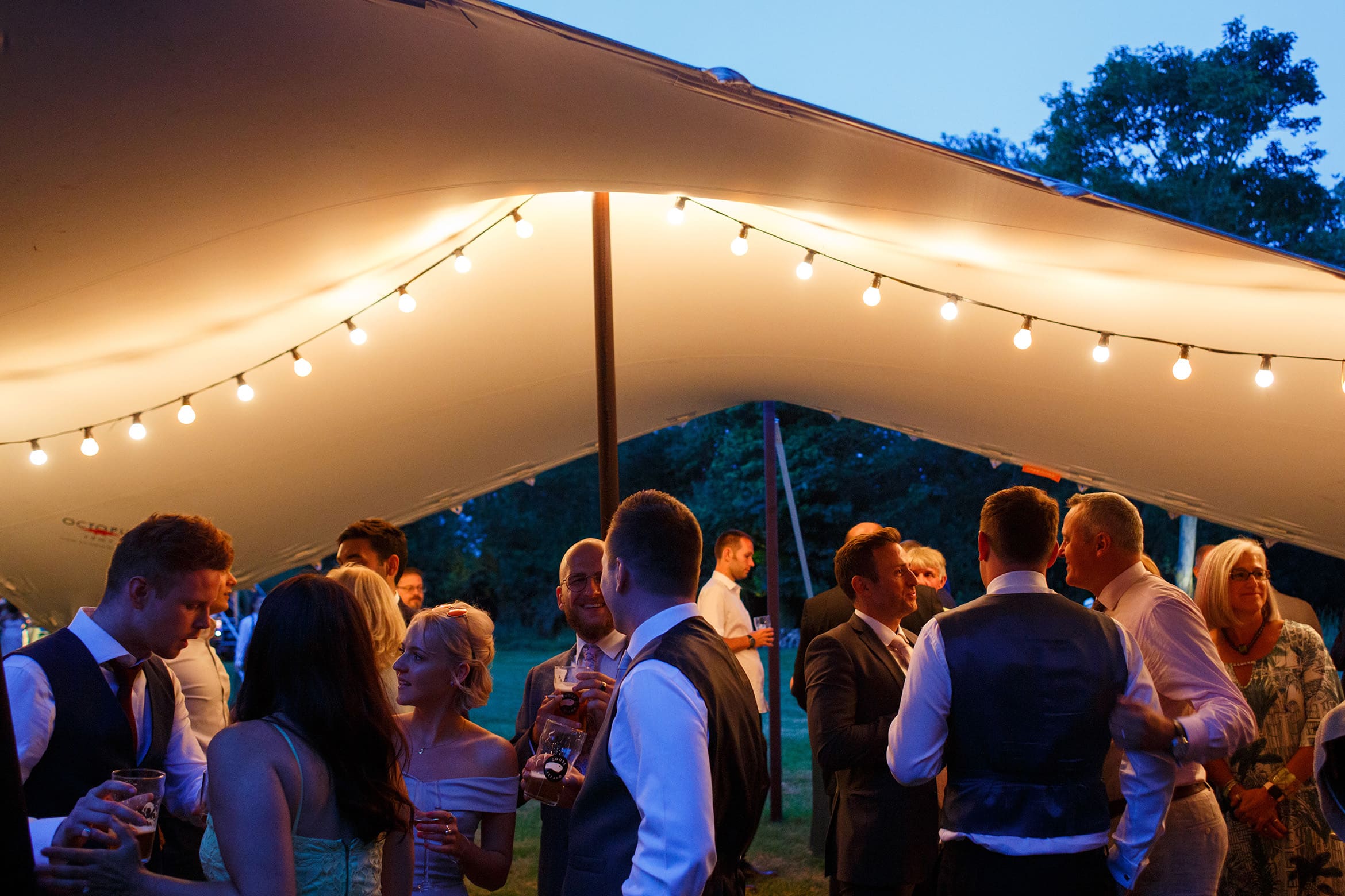 guests enjoy drinks outside