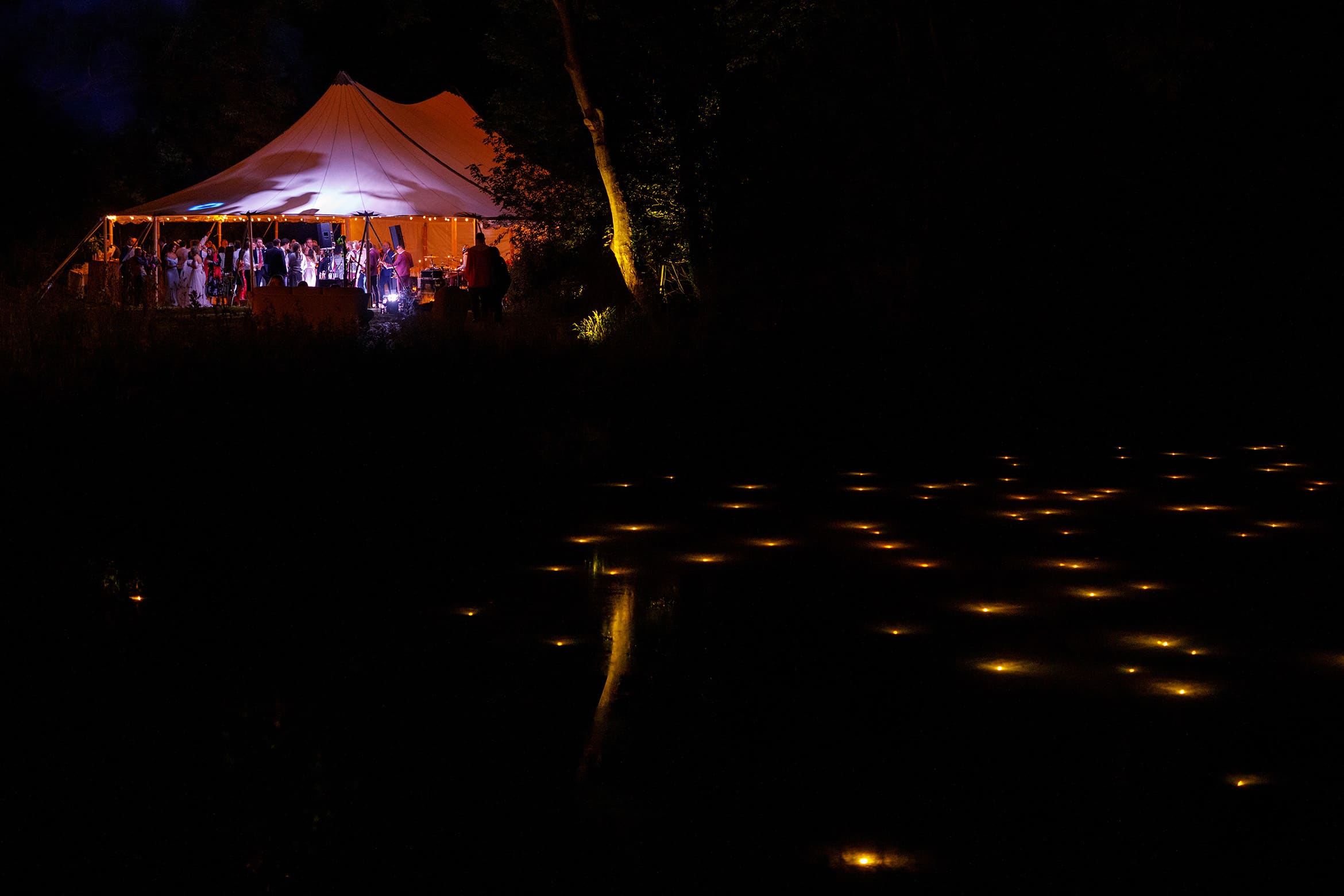 the marquee seen from the pond