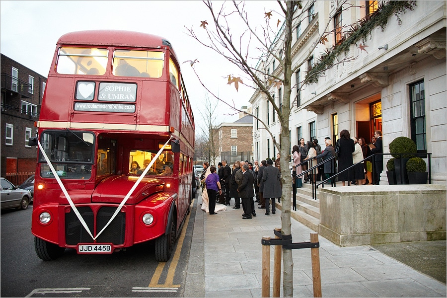 wedding guests getting on the bus