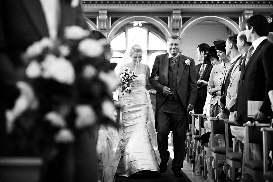 bride and father walk up the aisle