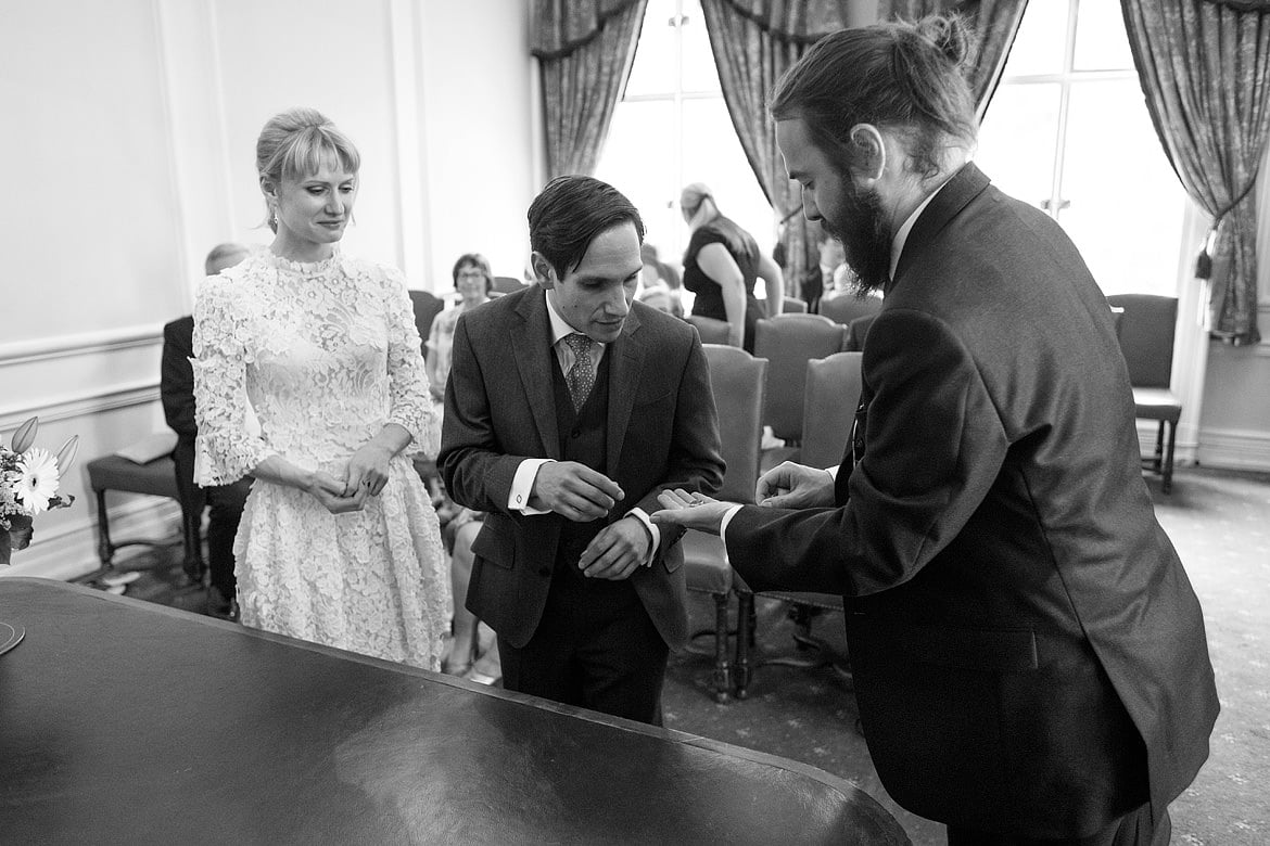 the best man hands david the wedding ring