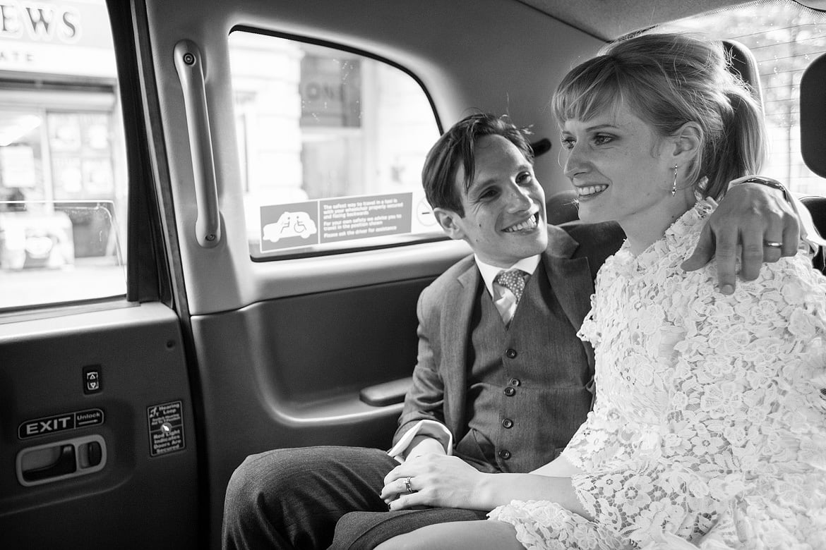 bride and groom in the taxi
