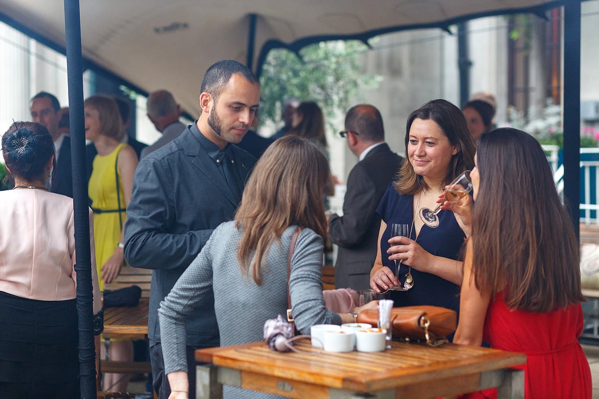 wedding guests talking outside