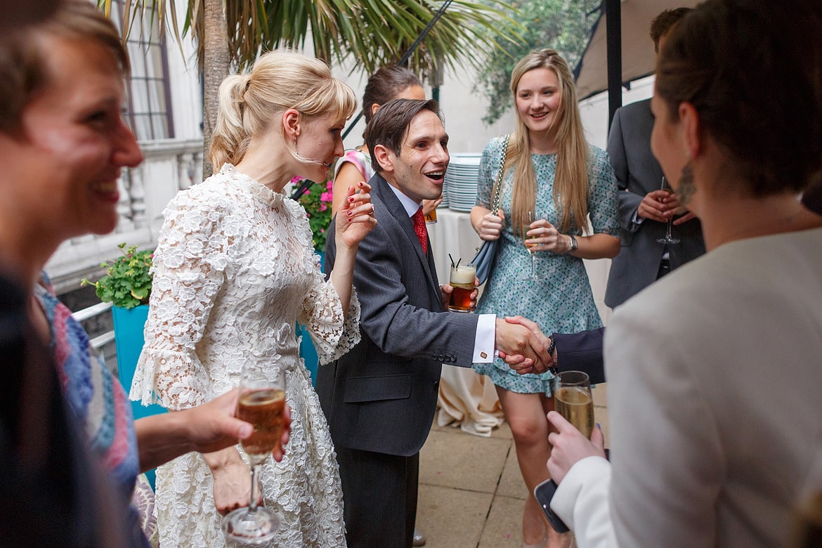 bride and groom greeting guests