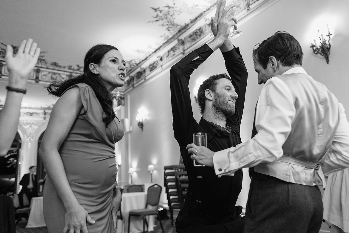 the groom dances with a tall friend