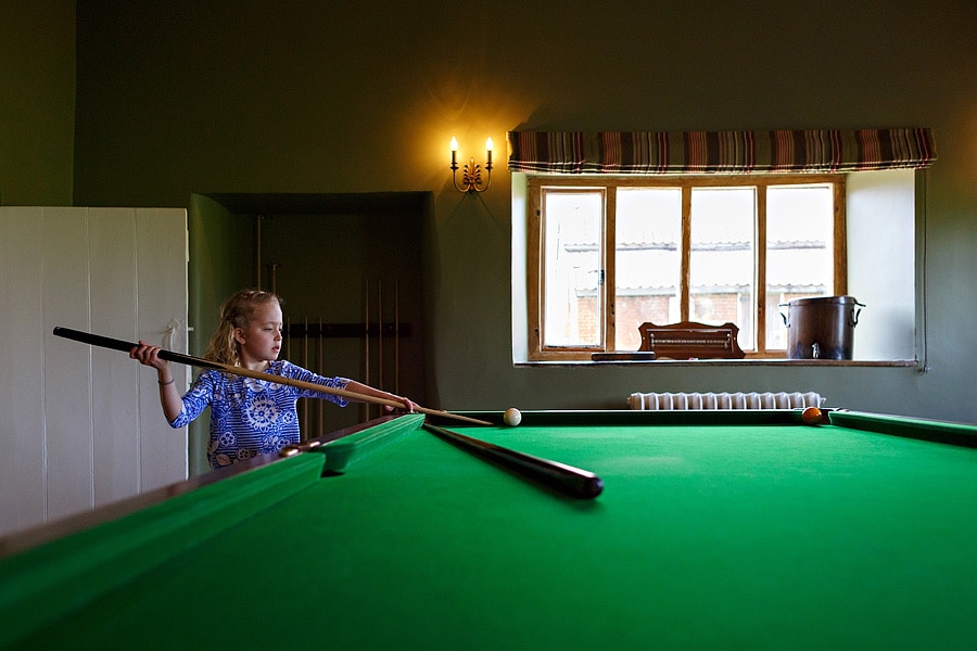 one of the flowergirls plays snooker