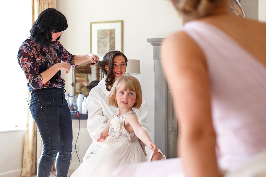 the bride has her hair done