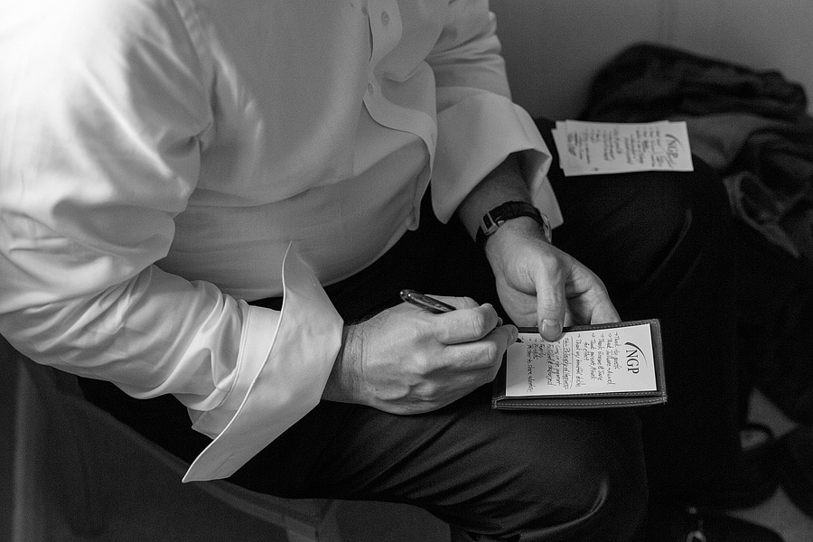 the groom sits alone and writes his speech