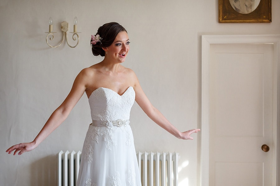 the bride with her dress on for the first time