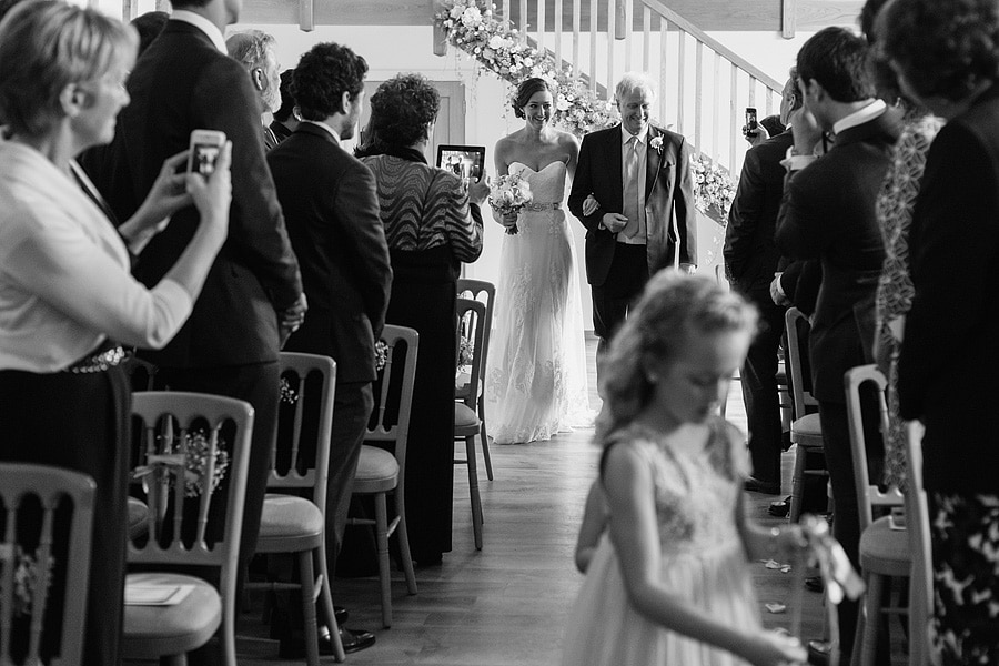 bride and father enter the ceremony room