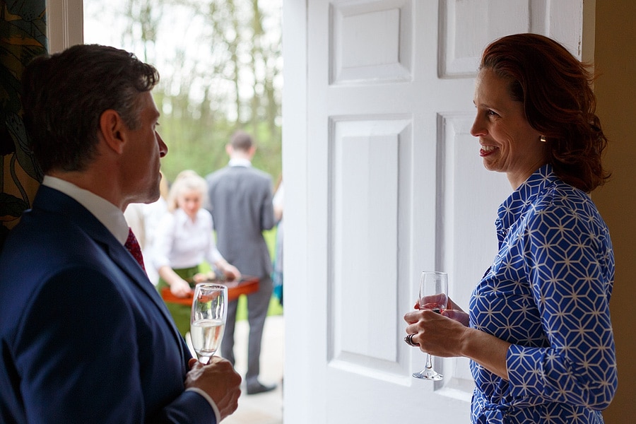 guests chat in a doorway