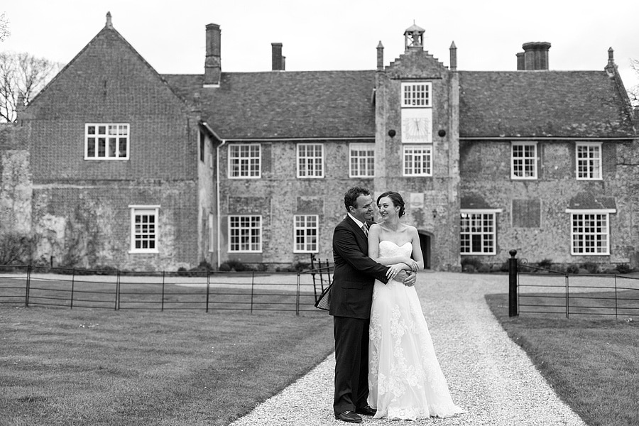 laura and brooks pose in front of bruisyard hall