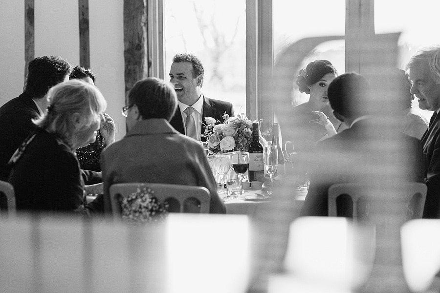 bride and groom at their bruisyard hall wedding breakfast