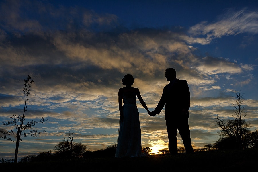 a sunset silhouette outside bruisyard barn