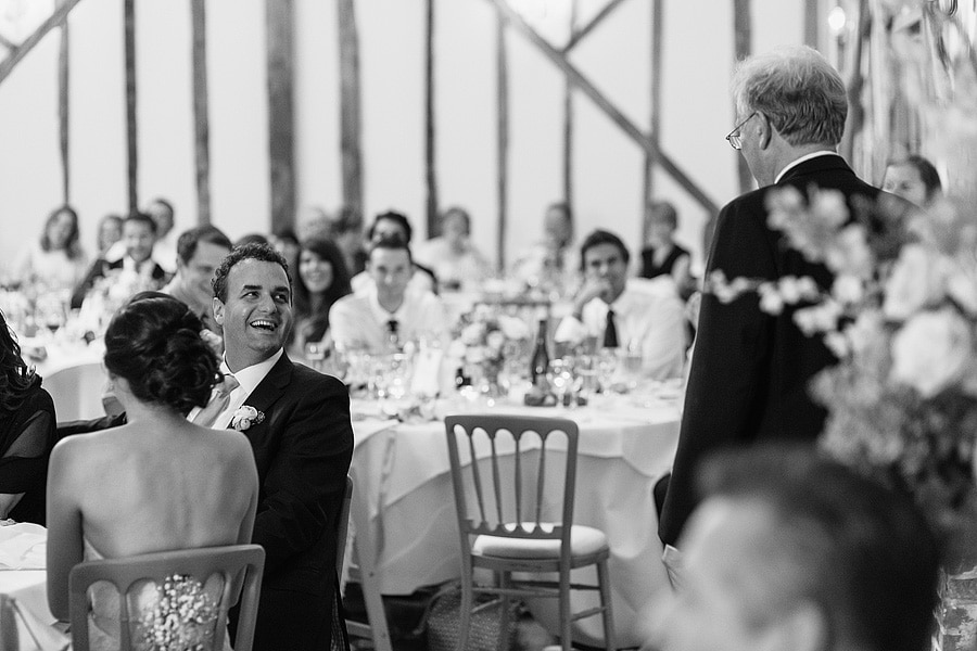 the groom laughs at the father of the brides speech