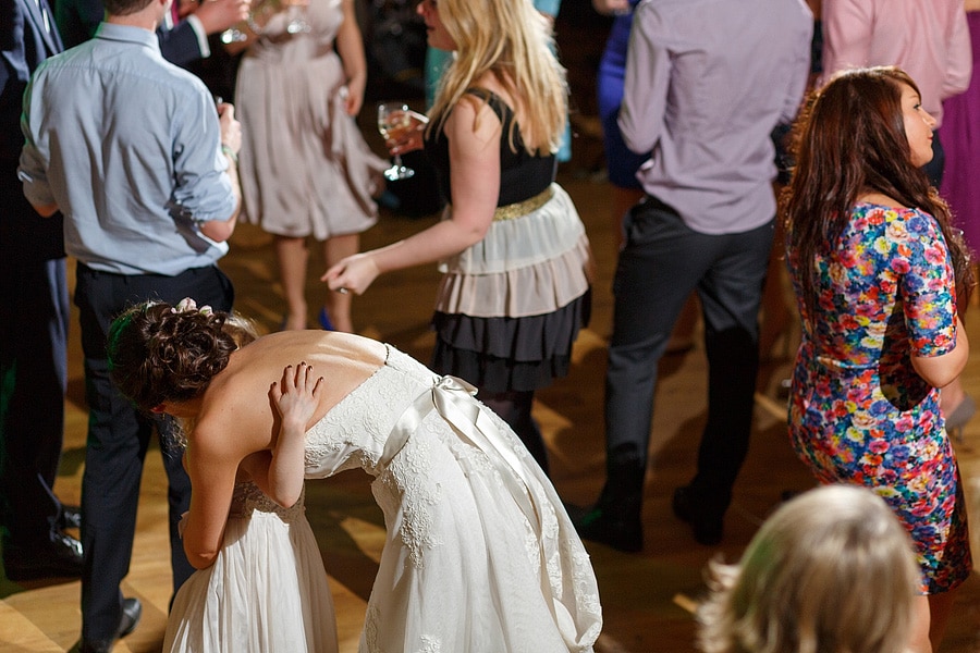 the bride hugging a flower girl