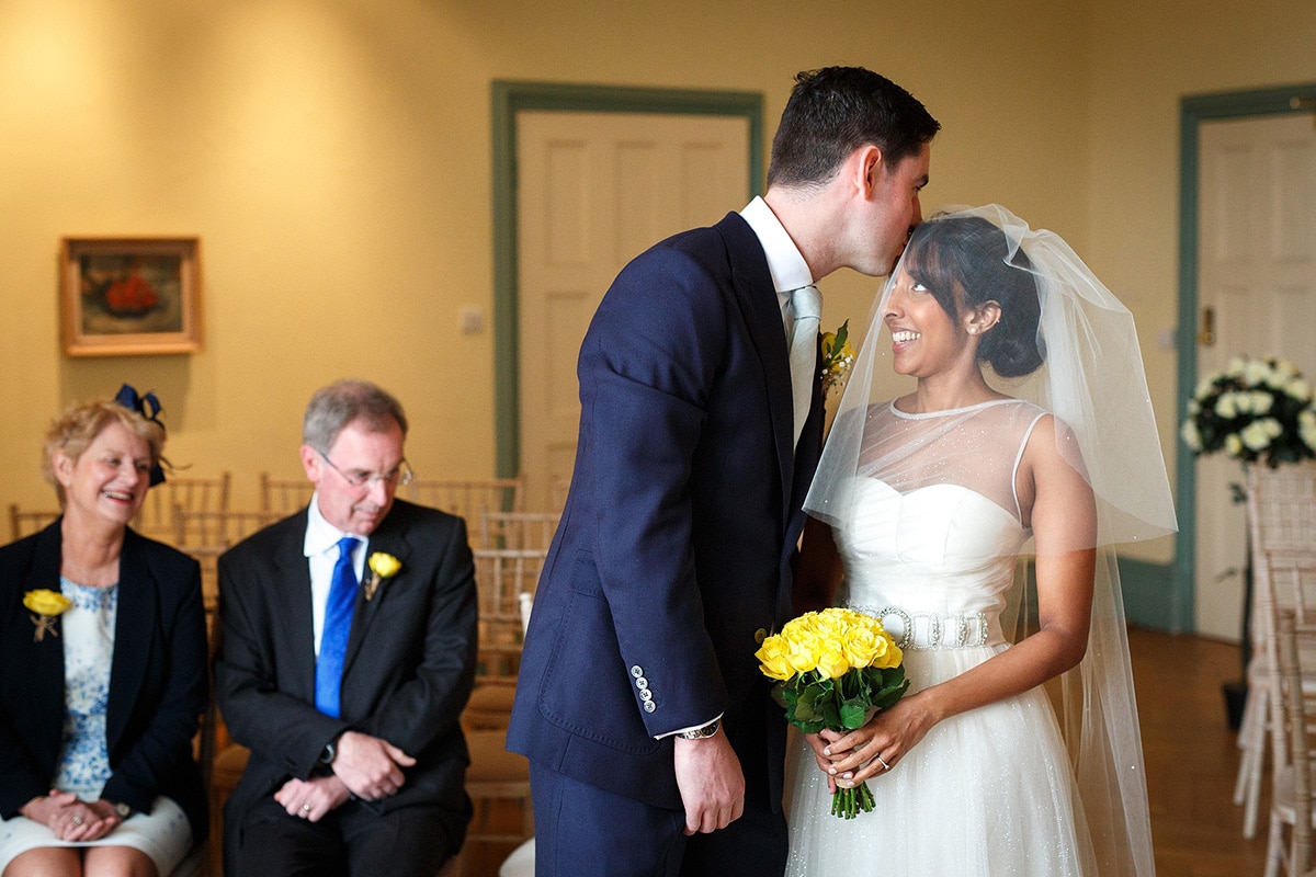 rob kisses sam on the head as she arrives for their wedding ceremony