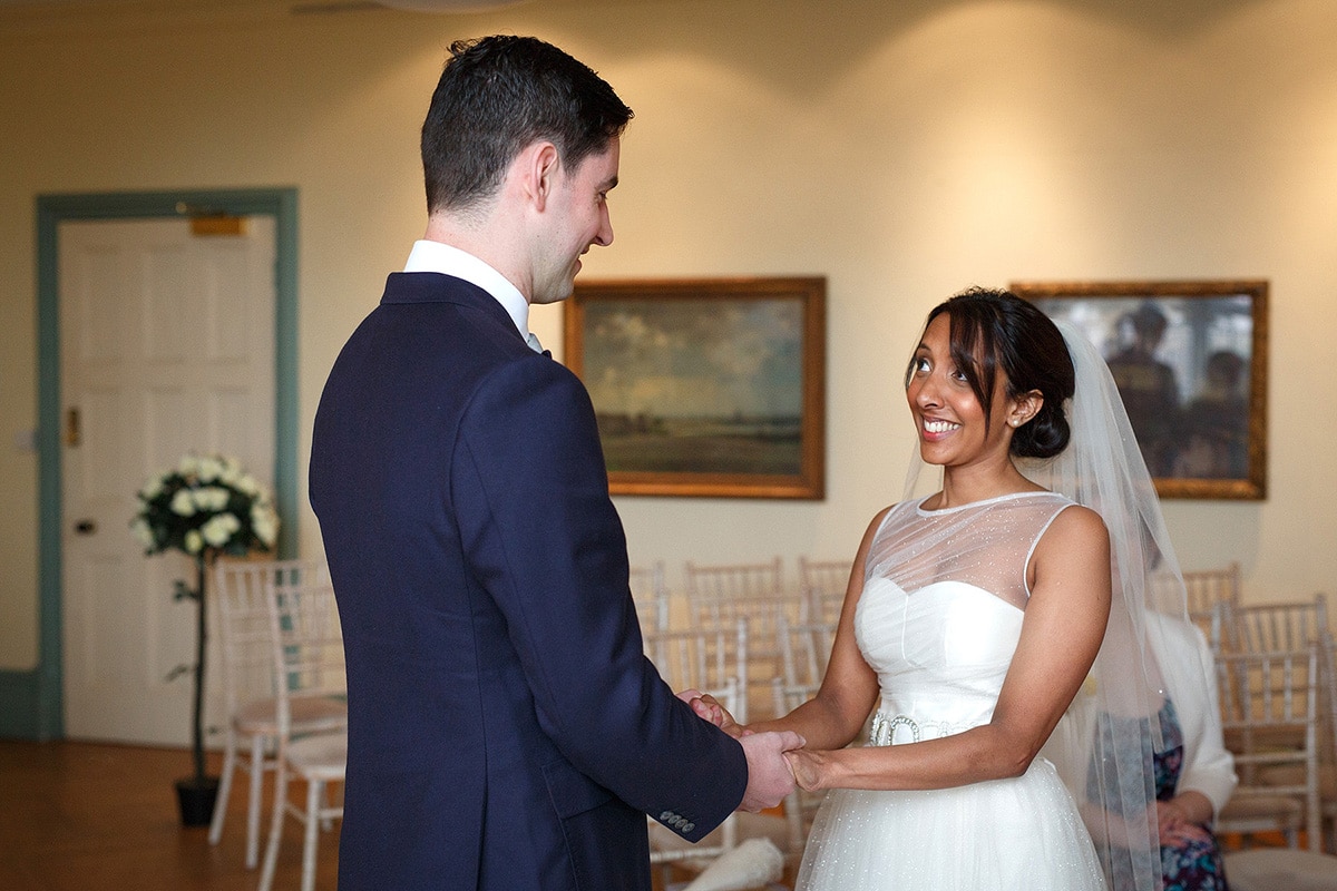 sam smiles at rob during their norwich castle ceremony