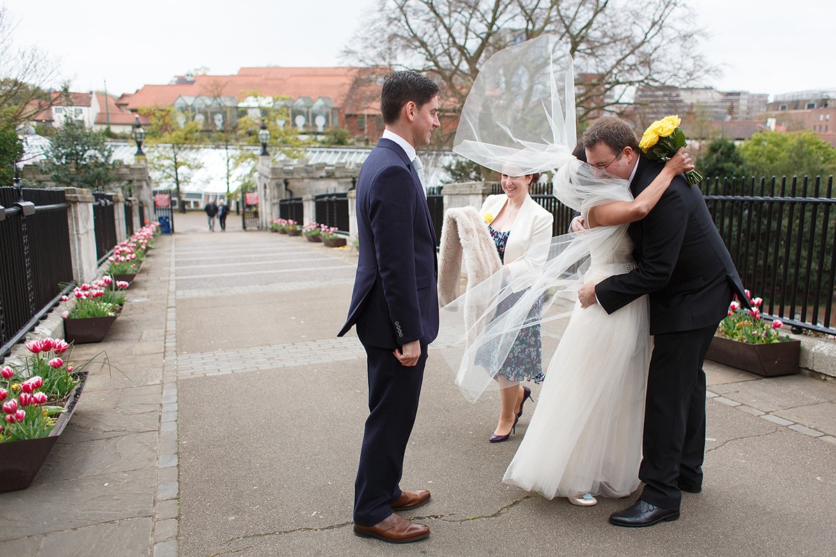 bride with veil blowing in the wind after their norwich registry office wedding