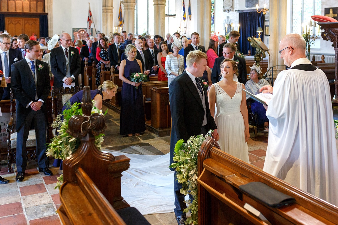 the groom greets the bride in church